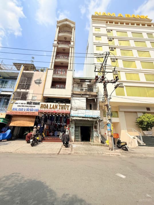 Nhà mặt chợ Tân Bình, 4x25m, đường Lê Minh Xuân